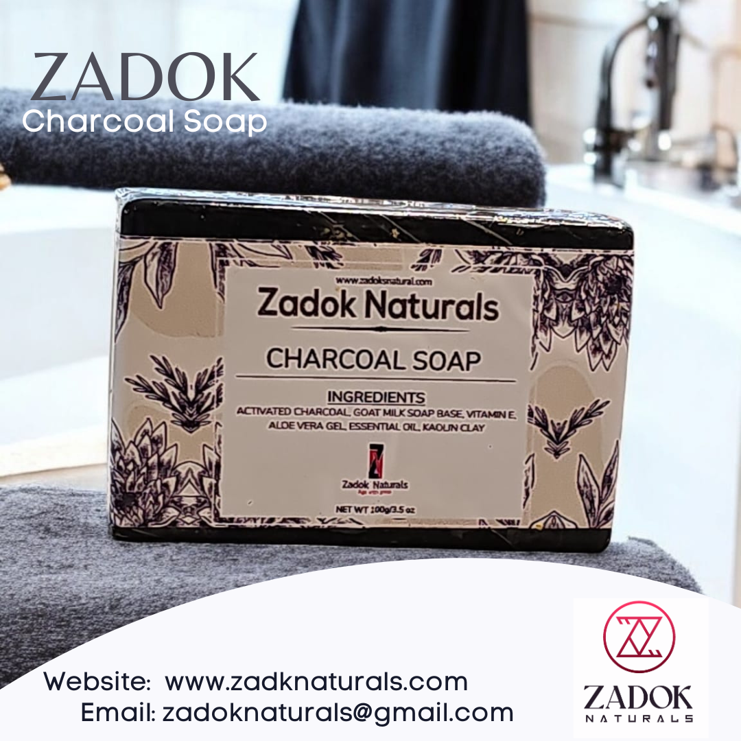 Zadoknaturals Charcoal Soap in a bathroom setting, featuring a sleek black bar with blurred towels in the background for a clean, spa-inspired look.